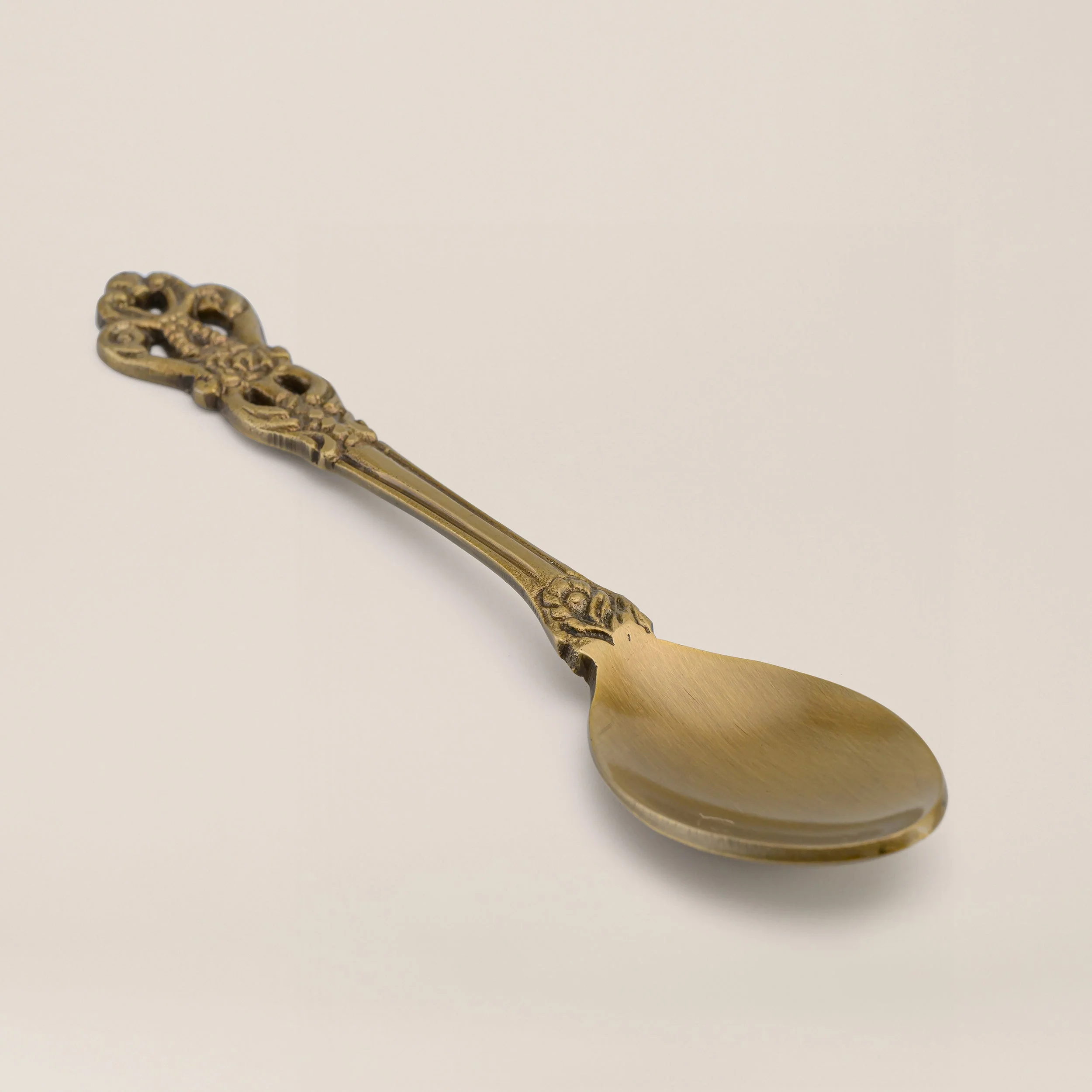 Handmade brass spoons manufactured in India featuring serving, decorative, engraved, hammered, and custom brass spoon designs for wholesale buyers and global importers.